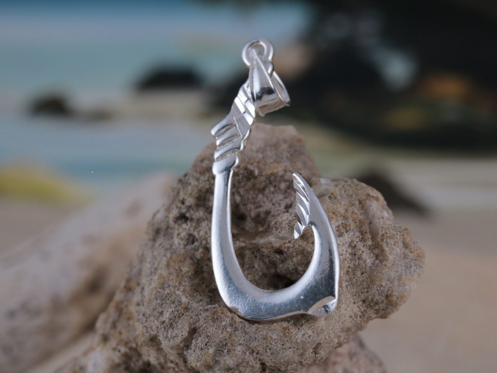 https://www.jewelrynetworkinc.com/wp-content/uploads/2023/04/hawaiian-fish-hook-pendant-sterling-silver-with-matte-finish-and-diamond-cut-details-fishermans-jewelry-free-fast-shipping-gift-for-men-642c6c85.jpg
